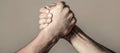 Arms wrestling. Closep up. Friendly handshake, friends greeting, teamwork, friendship. Handshake, arms, friendship. Hand Royalty Free Stock Photo