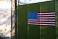 army concept: a green iron gate with a painted American flag Royalty Free Stock Photo