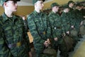 Army conscripts receiving military uniform