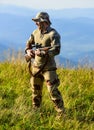 Army forces. Ready to shoot. Hunter hold rifle. Hunter mountains landscape background. Focus and concentration Royalty Free Stock Photo