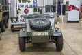 A army green military car with a tire on the hood at USS Alabama Battleship Memorial Park in Mobile Alabama Royalty Free Stock Photo