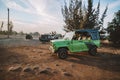 Army Green Off Road Car Vehicle Ready for Adventure on Sand Dunes in Mui Ne, Vietnam on Desert Landscape and Blue Sky Background Royalty Free Stock Photo