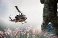 Army Helicopter is landing on the open field Royalty Free Stock Photo