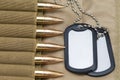 Army identification medallions, bandolier with cartridges, Concept: military special operation, sniper work in war, financing of w