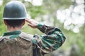 Army, man back and salute portrait in military of a veteran with security, protection and battle. Male person, soldier Royalty Free Stock Photo