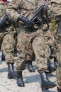 Army parade - armed soldiers in camouflage military uniform are marching Royalty Free Stock Photo