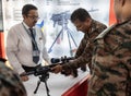 An army personnel looks a weapon displayed at a stall during ' East Tech 2023' , hosted by The Eastern command of the In