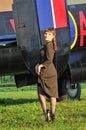 Army pinup girl with WWII bomber