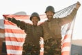 Army, portrait of man and woman with American flag, solidarity and team pride together at war time. Smile, happiness and Royalty Free Stock Photo