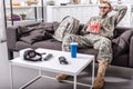 army soldier in military uniform wearing 3d glasses, eating popcorn and watching movie