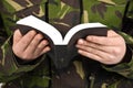 Army soldier reading bible