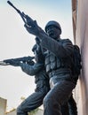 army soldier statue showing battlefield action at war memorial at evening