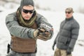 Army soldier training combat gun winter snow shooting with instructor