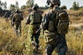 Army soldiers group in combat uniform and helmets goign on countryside road Royalty Free Stock Photo