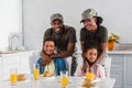 Army soldiers with happy kids enjoying meal