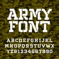 Army stencil alphabet font. Type letters and numbers on a green camo seamless background. Royalty Free Stock Photo