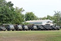 Army trucks, government vehicles parked in outdoor lawn military driving training concept