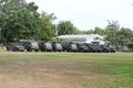 Army trucks, government vehicles parked in outdoor lawn military driving training concept