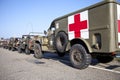 Army trucks of organization Kelly's Heroes riding on beach