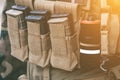 Army vest with a walkie-talkie charged collars stun grenades luminous sticks standing on a wooden box of ammunition