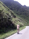 a Armyman walking on the way hill area Royalty Free Stock Photo