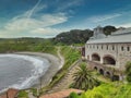 Arnao beach and ancient coal mine building, Castrillon, Asturias, Spain