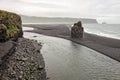 Arnardrangur rock in the middle of peninsula near Reynisfjara Beach view point Dyrholaey in very bad rainy weather