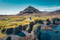 Arnarstapi fishing village with nordic house and stapafell mountain on coastline in Snaefellsnes peninsula at Iceland Royalty Free Stock Photo