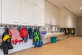 ARNHEM / NETHERLANDS - AUGUST 28 2020: Cloakroom with coats and backpacks in a school building for toddlers and young children