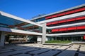 View on large inner courtyard of modern town hall with reflecting glass facade and red awnings Royalty Free Stock Photo