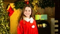 Arnival costume rental. Little girl celebrate christmas. Happy childhood. Celebrate new year near christmas tree