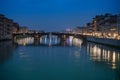 Arno River, view from Ponte Vecchio after Sunset, Reflections of Lights, Colours and the Ferris Wheel in Florence, Italy Royalty Free Stock Photo