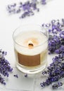 Aroma Candle. Lavender candle on a white tile background