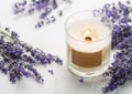 Aroma Candle. Lavender candle on a white tile background