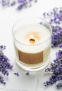 Aroma Candle. Lavender candle on a white tile background