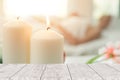 Aroma candle spa with wooden table forground for advertising Royalty Free Stock Photo