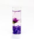 Aroma candles in a glass with flowers