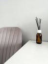 Aroma diffuser on the table, near a gray wall, space for text.