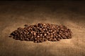 Aroma flavor coffee grains, beans on textured background Royalty Free Stock Photo