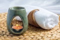 Aroma lamp with grapefruit essential oil, spa background, horizontal