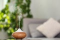 Aroma oil diffuser lamp on table blurred background Royalty Free Stock Photo