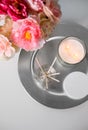 Aroma reed diffuser, candle and flowers on table Royalty Free Stock Photo