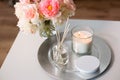 Aroma reed diffuser, candle and flowers on table Royalty Free Stock Photo