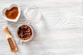 Aroma spa set. Coffee scrub, coffee grains, coffee spa salt on wooden table background top view copyspace Royalty Free Stock Photo