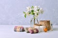 Aroma spa treatment background with handmade soap, aroma candles, flowers, aromatic oils and stones on the wooden table.