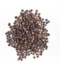 Aroma  spice black  pepper is scattered on a white isolated background. Top view Royalty Free Stock Photo