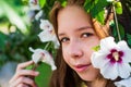 Aroma. summer fashion and beauty. beautiful teen girl with hibiscus bush flower. kid spring fashion style. happy Royalty Free Stock Photo