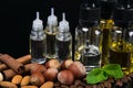 Aromas of nuts and mint mixed in bottles, concept on a black background