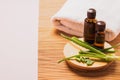 Aromatherapy bottle fresh aloe leaf oil cosmetic spa treatments. The concept of natural alternative homemade cosmetics.