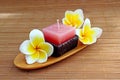 Aromatherapy candle with fresh frangipani flower Royalty Free Stock Photo